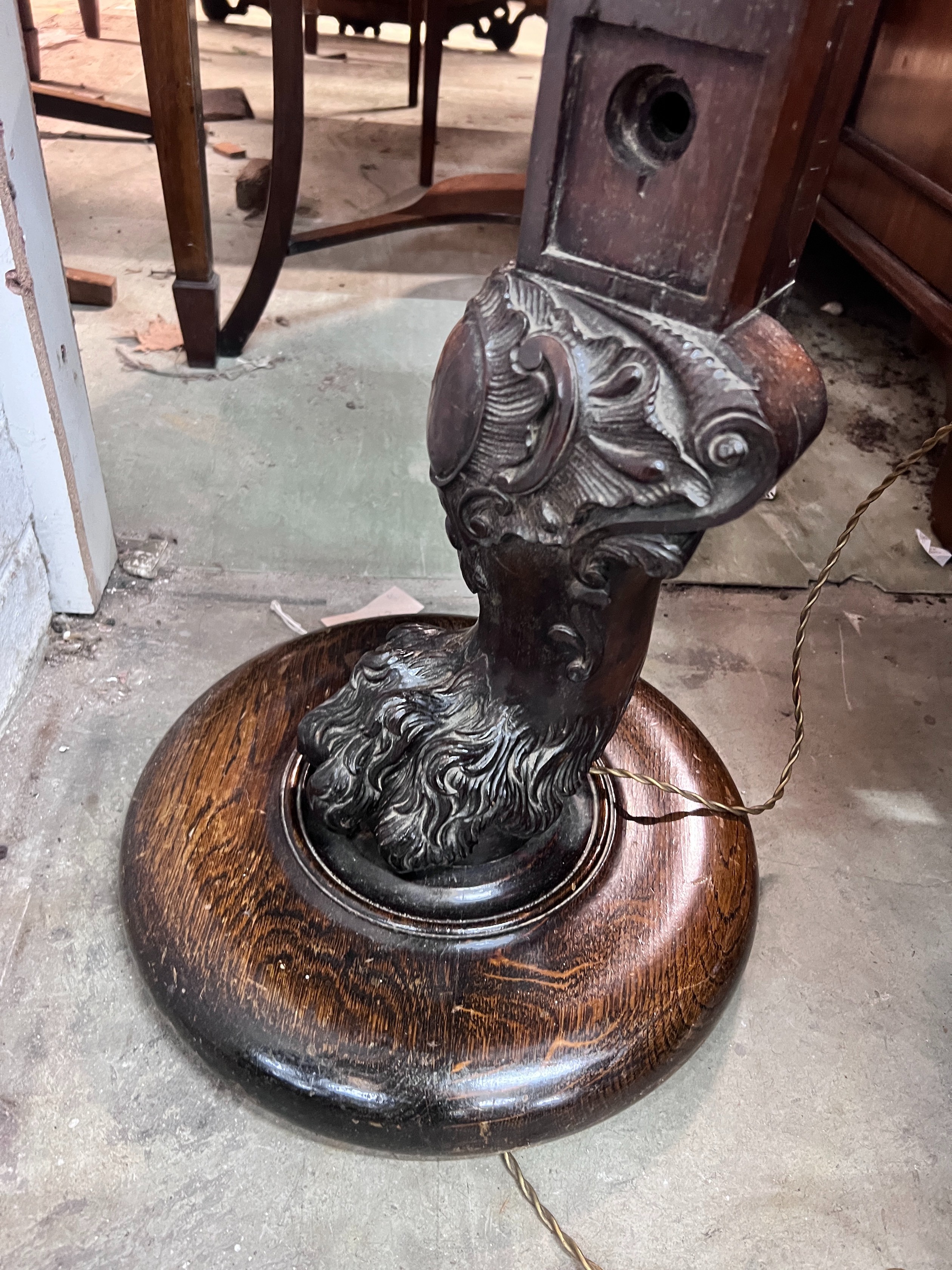 A carved oak and mahogany carved standard lamp, height 151cm *Please note the sale commences at 9am.